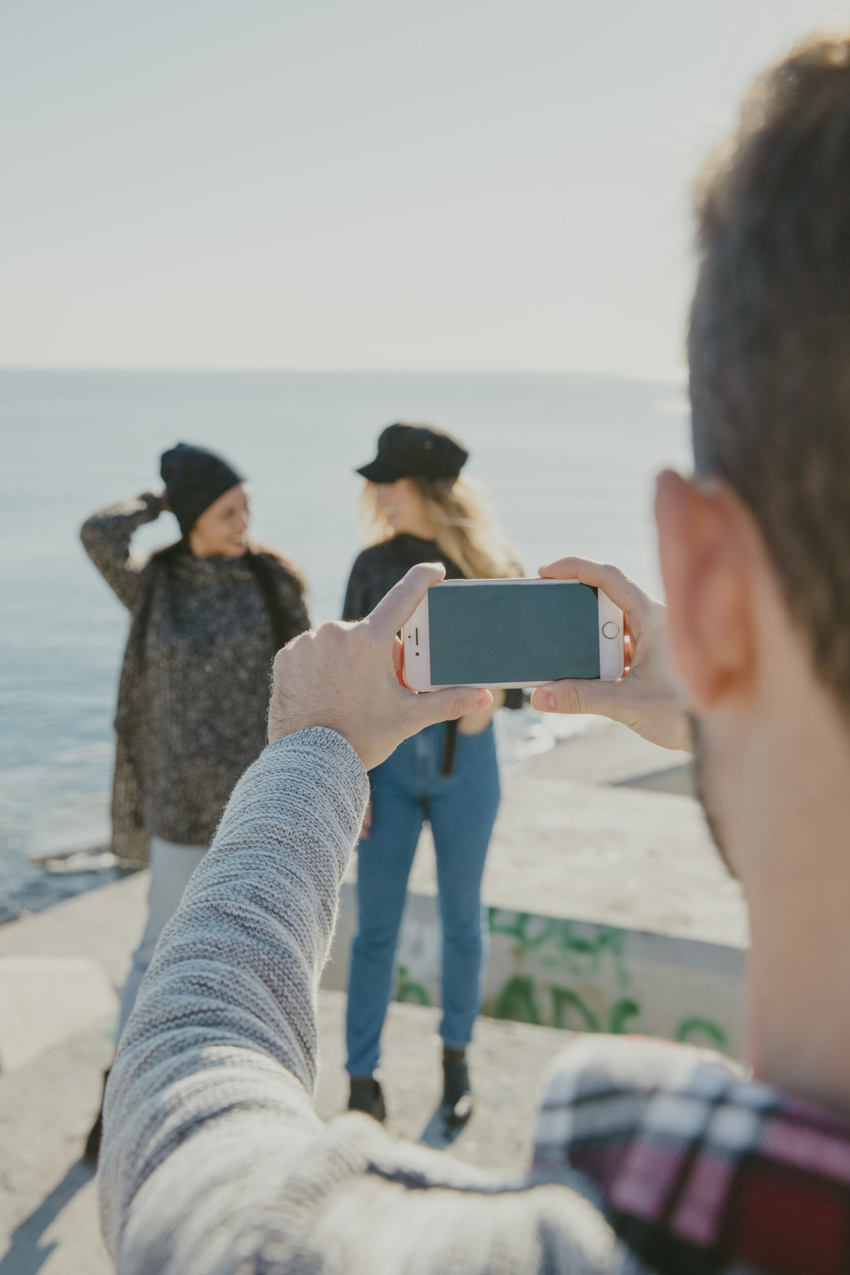 man-taking-photo-women